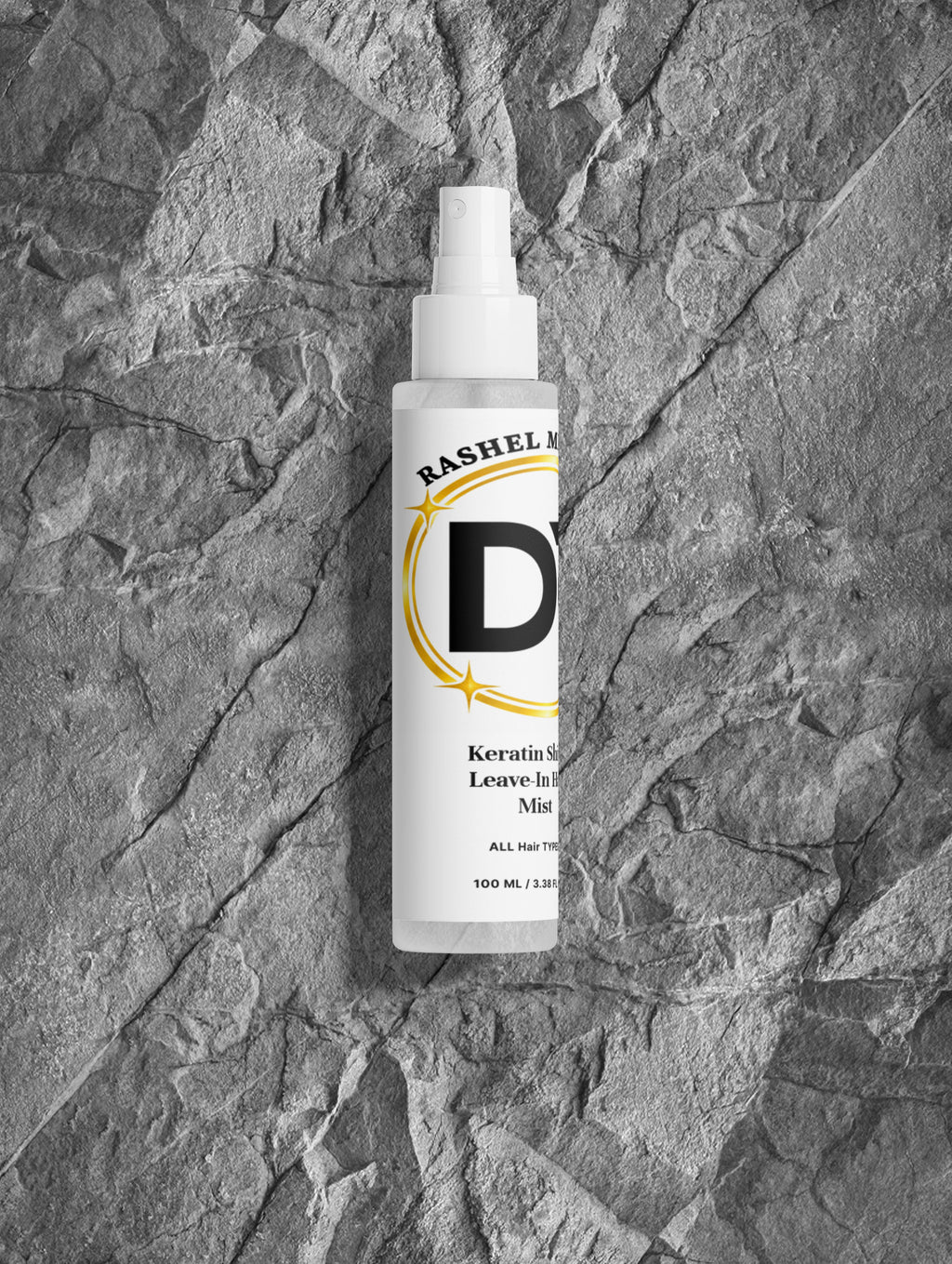 Rashel Miracle Keratin Shine Leave-In Hair Mist Spray bottle on gray stone background