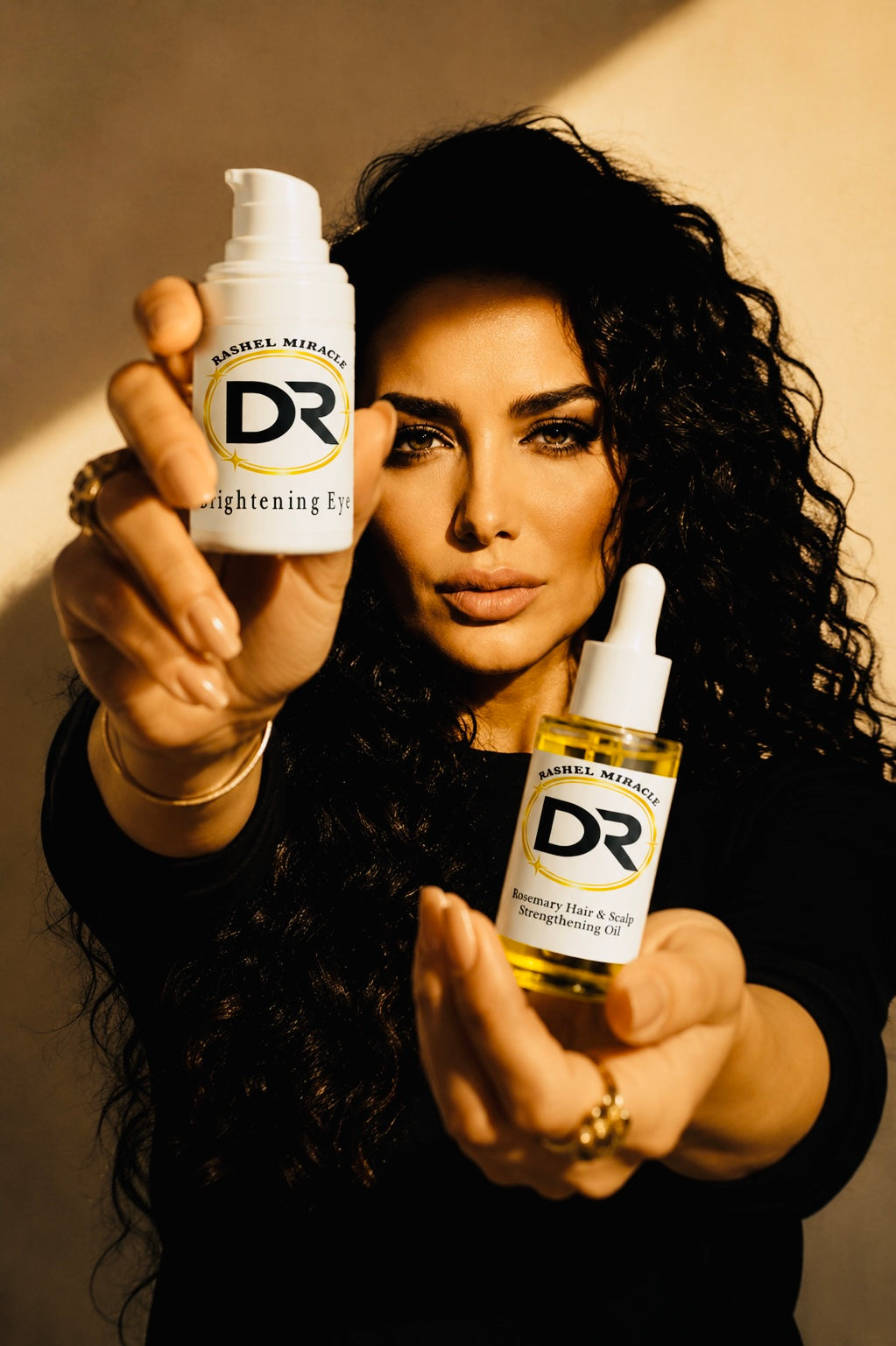 Rashel Pouri holding Rashel Miracle Brightening Eye Serum and Peptide Face Serum