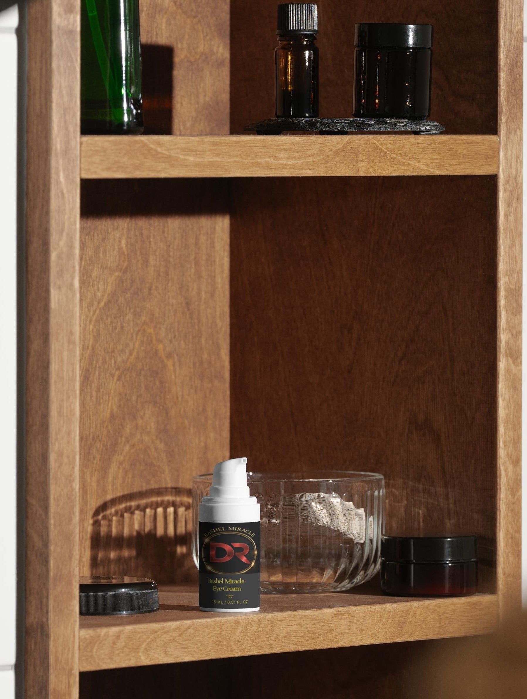 Rashel Miracle Brightening Eye Serum for dark circles and puffiness, featuring a sleek dropper bottle and smooth serum texture.